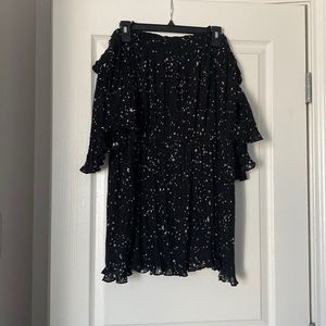 Black off the shoulder shirt. Has stars. Never worn